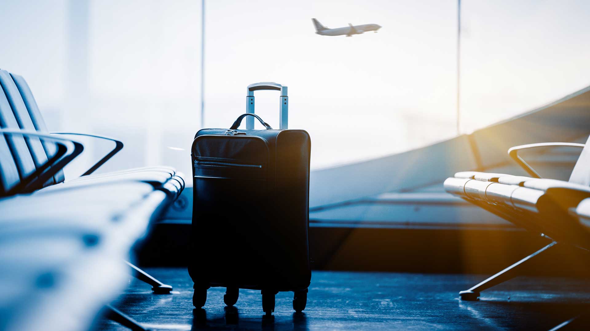 Airport departures suitcase in a waiting hall