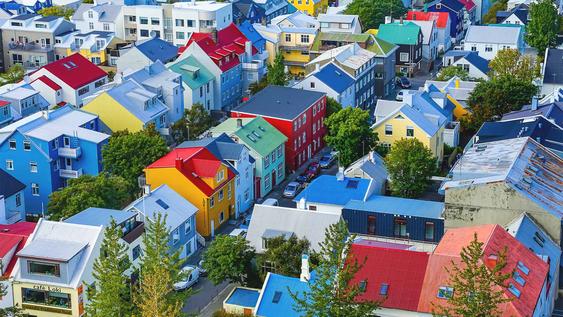 Reykjavik cityscape with colorful rooftops and spring greenery.