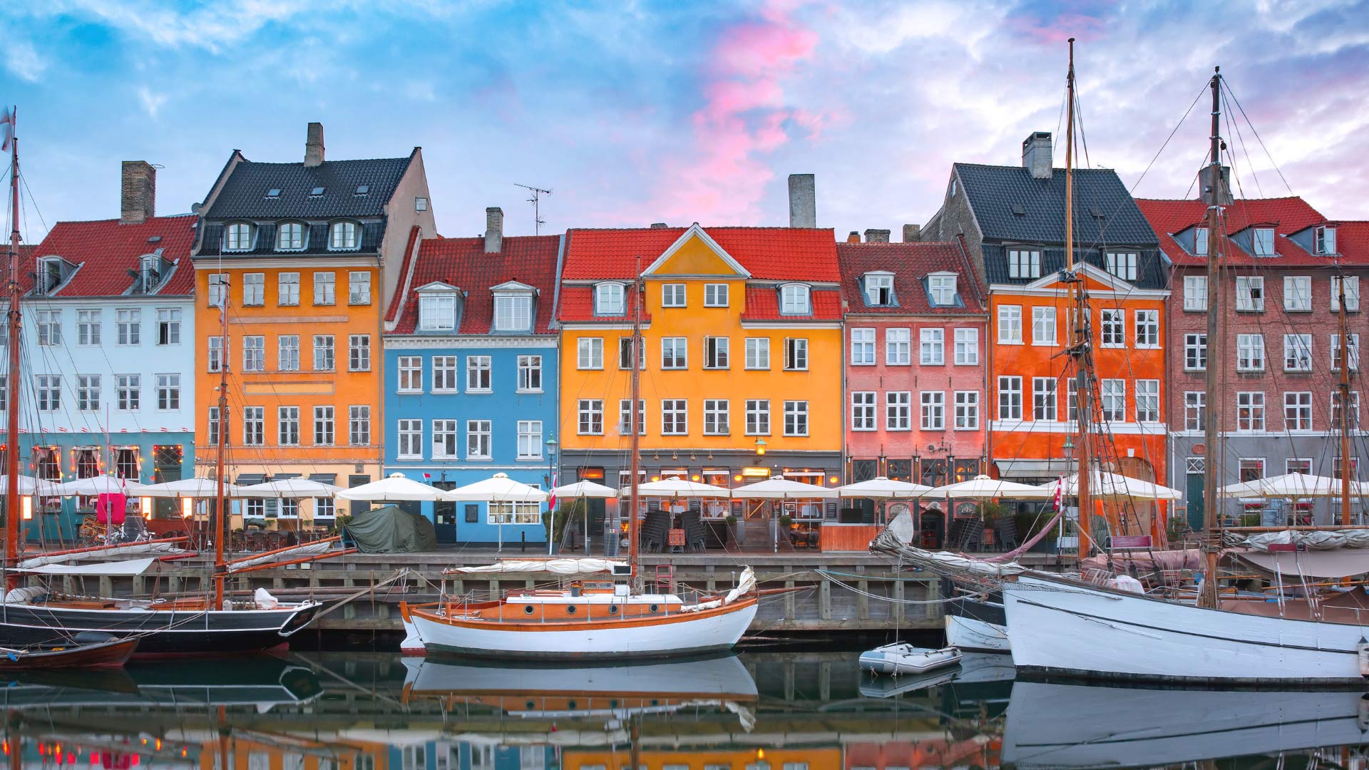 Nyhavn at sunrise, with colorful houses in the Old Town of Copenhagen, Denmark