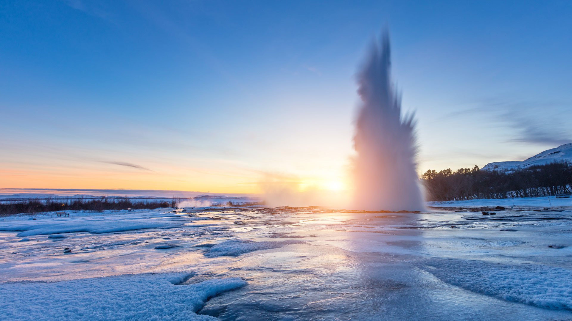 Stokkur geysir in beautiful sunset light, Iceland