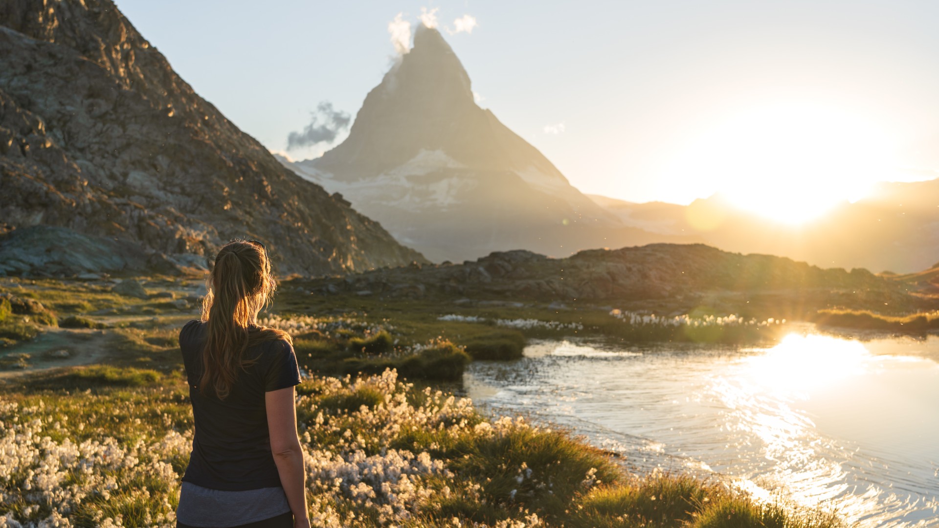 Hiker looking at the Matterhorn from Riffelsee Switzerland