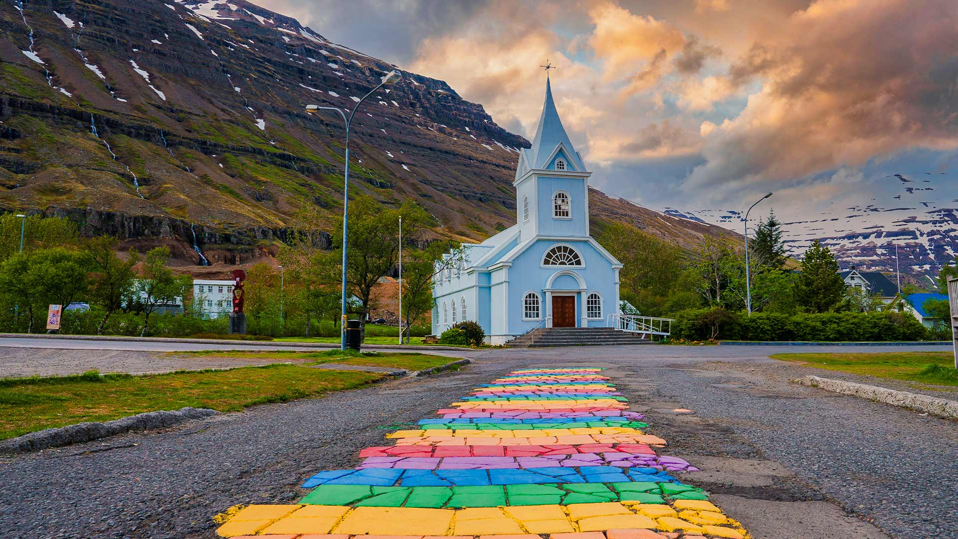 Charming Seyðisfjörður town Blue Church and rainbow path Iceland