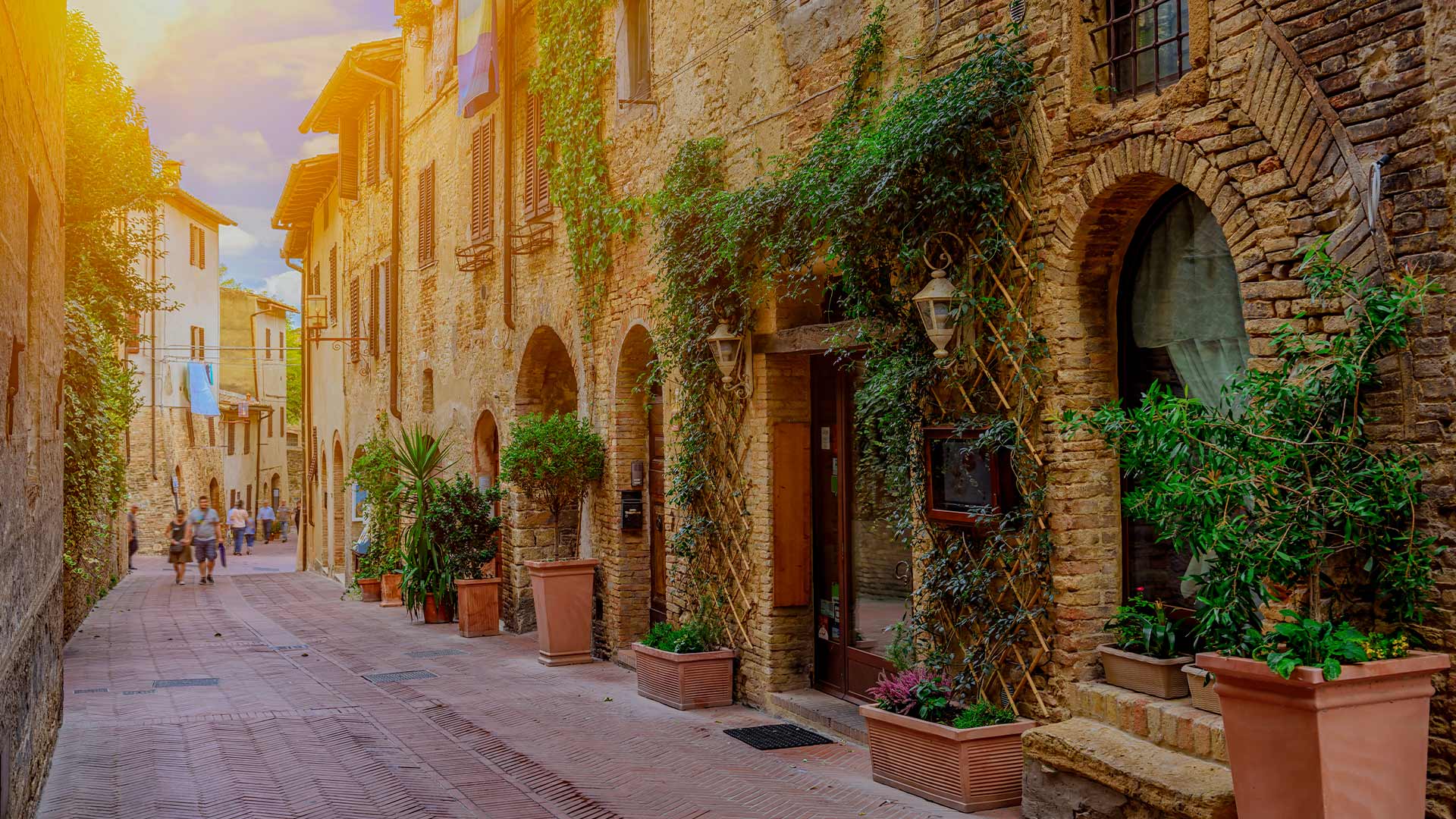 Narrow cobblestone street in medieval San Gimignano Tuscany