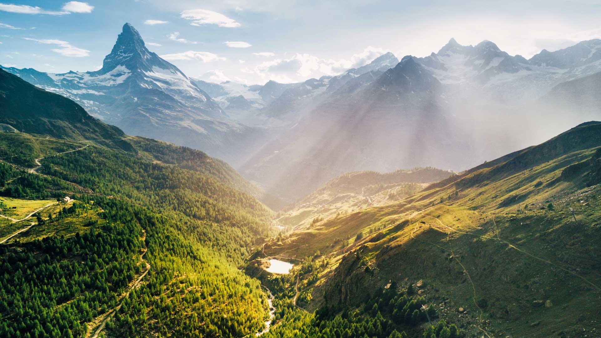 Light beams over Matterhorn mountain in Switzerland