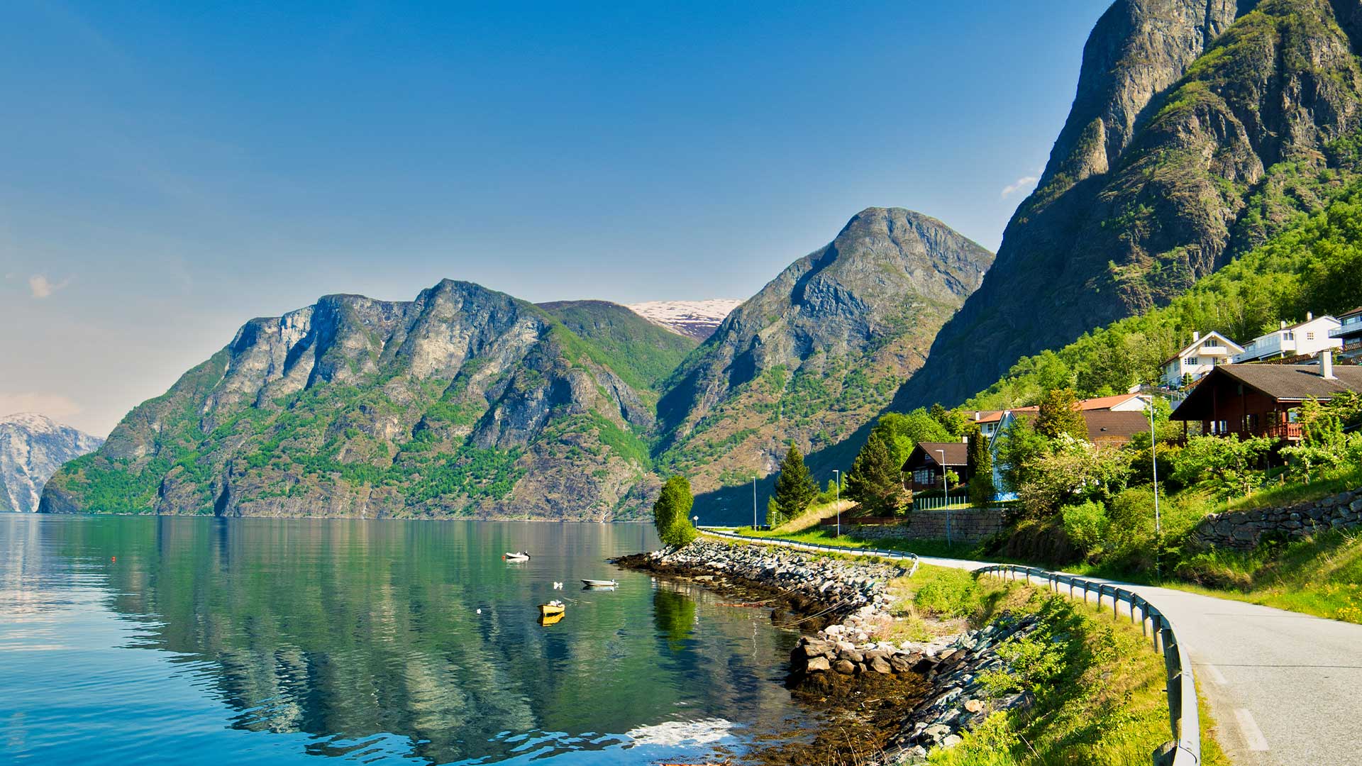 Norwegian fjord scenery with calm waters and sunny weather in Aurland