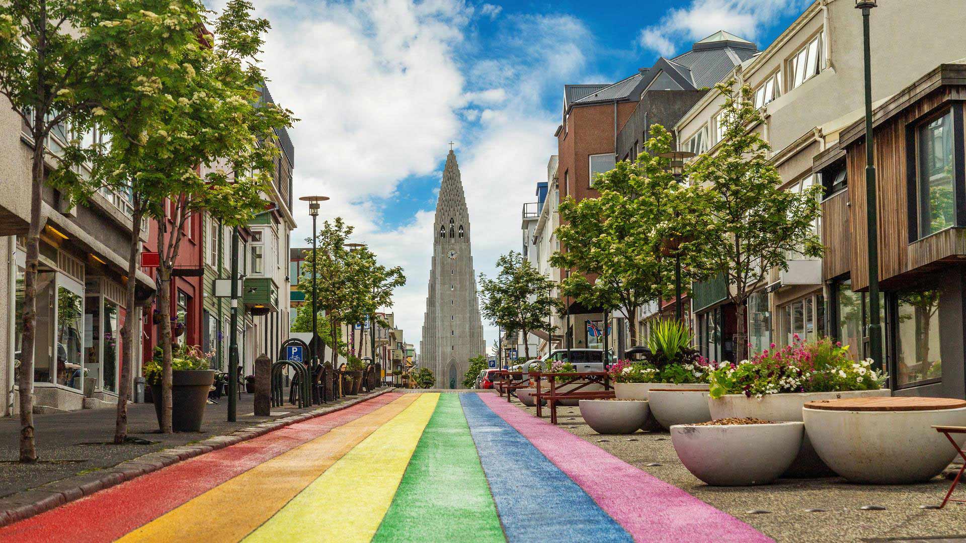 Rainbow street and Hallgrimskirkja church in Reykjavik