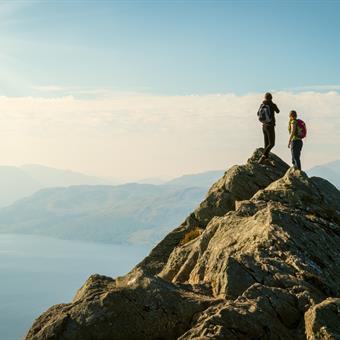 hikers at ben aan overlooking loch katrine trossachs