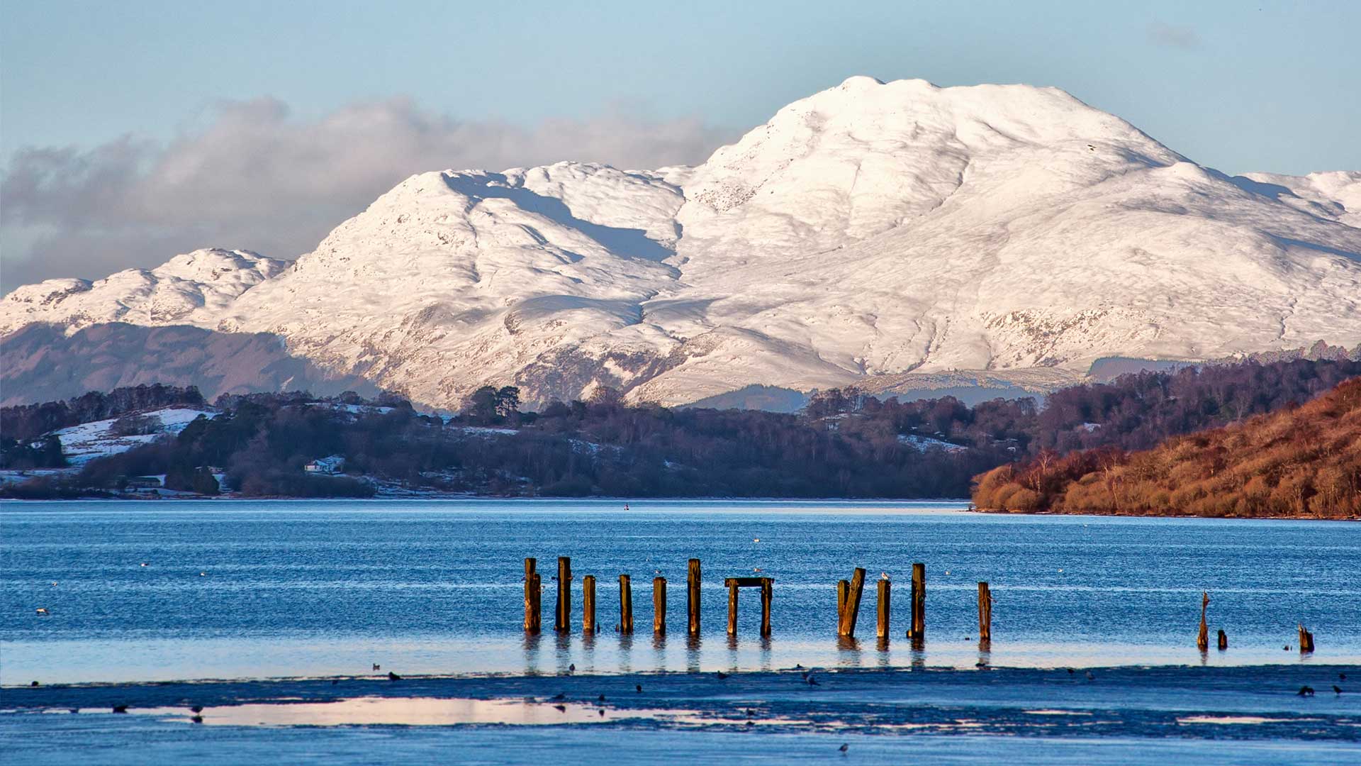 Winter view over Loch Lomond with snow-covered mountains