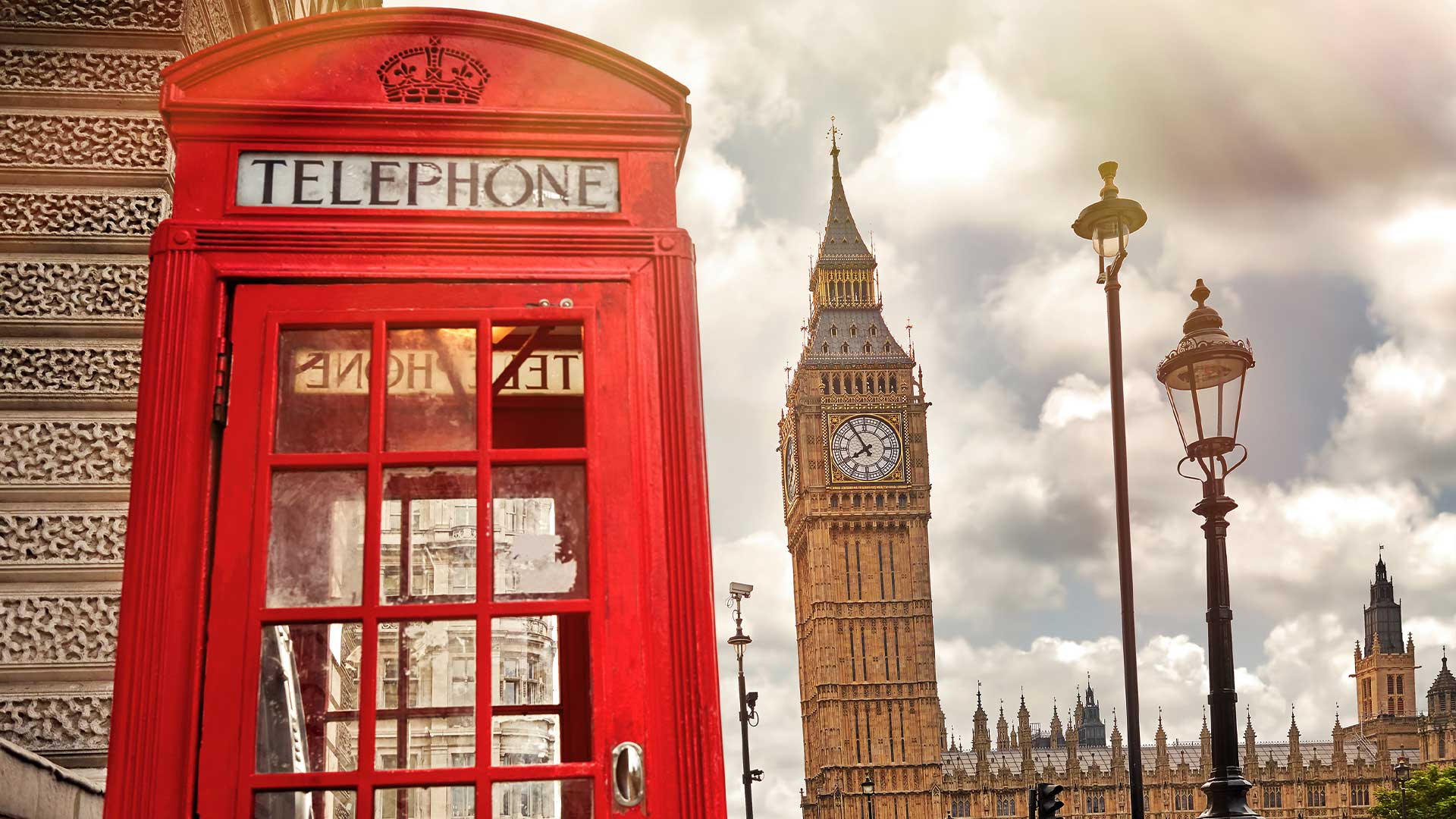 Red telephone box with Big Ben in the background, London