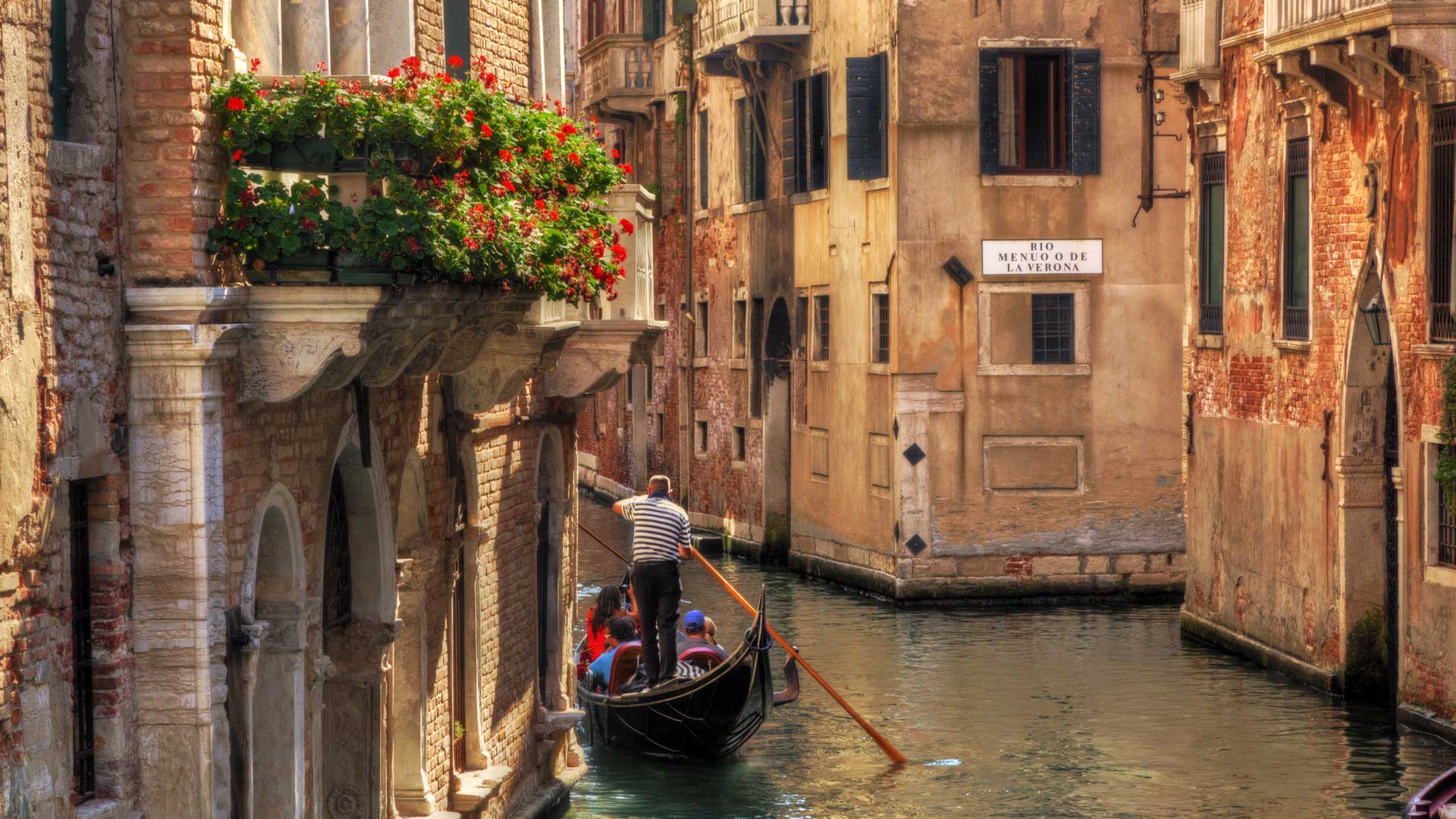 Gondola ride on the water canals in Venice, Italy