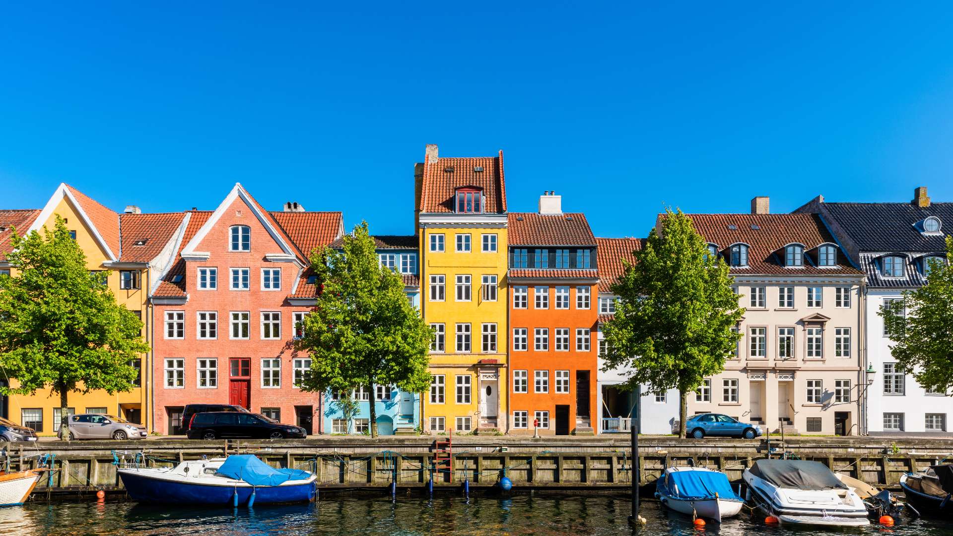 ad168308433 colourful houses along canal in downtown district of copenhagen denmark