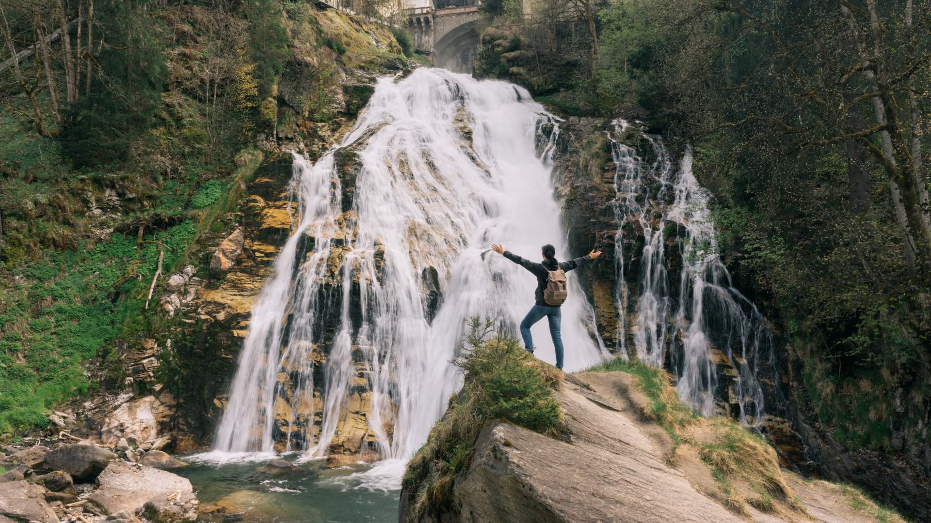 Standing by the Bad Gastein waterfall in the Austrian Alps