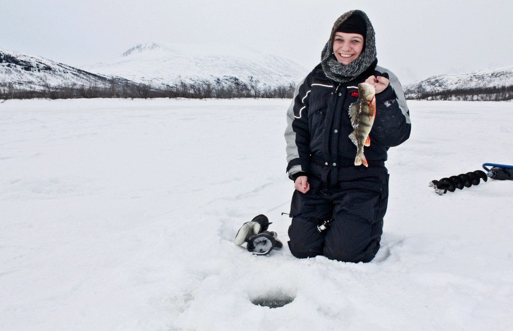 Success! girl holding a freshly caught fish