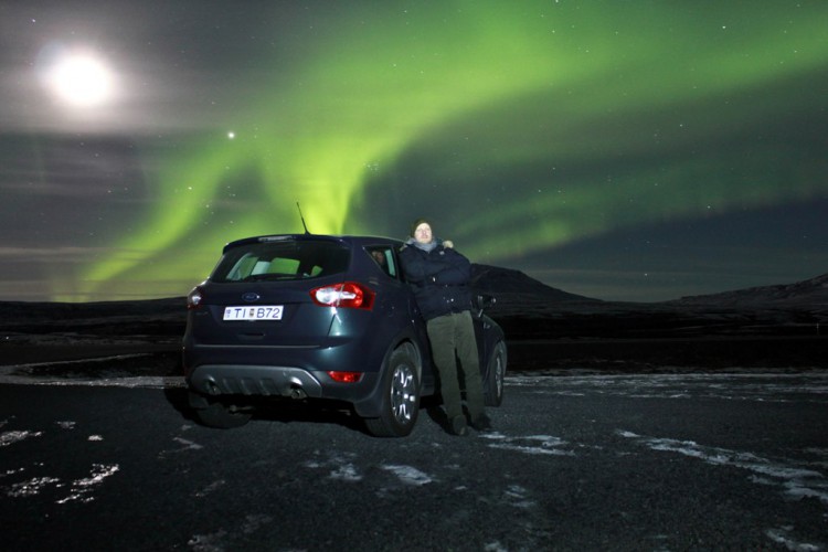 Nordic Visitor's founder, Ásberg Jónsson, checks out the aurora outside Reykjavík.