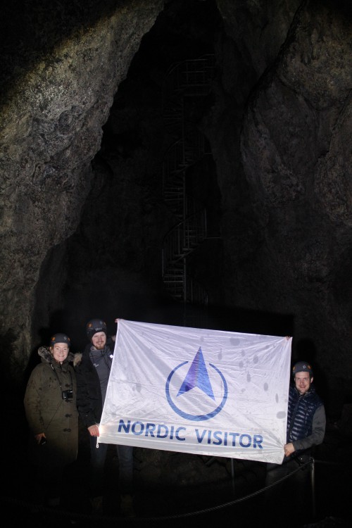 Catharine, Þór and Ævar stop for a quick photo op in the deepest point of Vatnshellir cave.