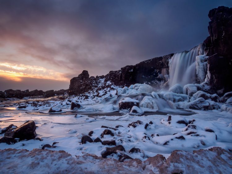 South Iceland waterfall in snow cover