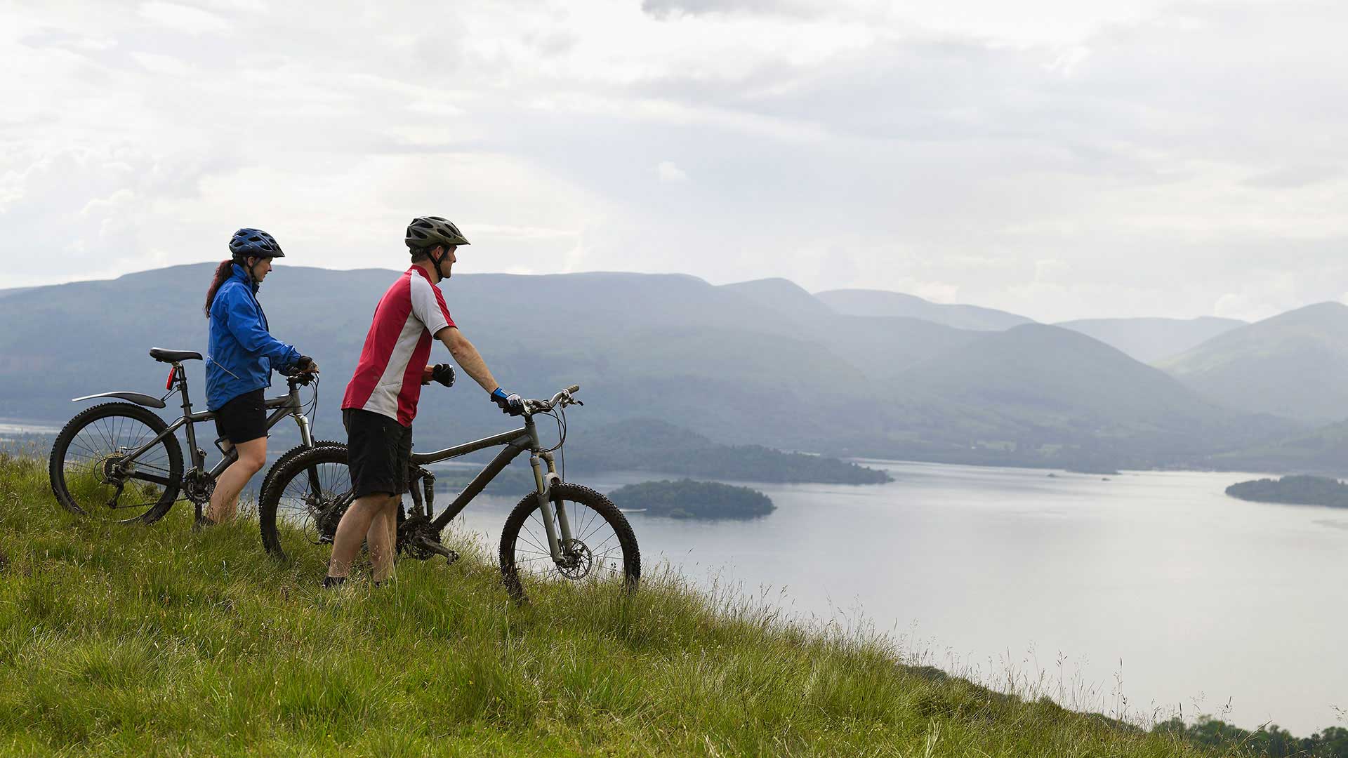 Couple mountain biking in Scotland
