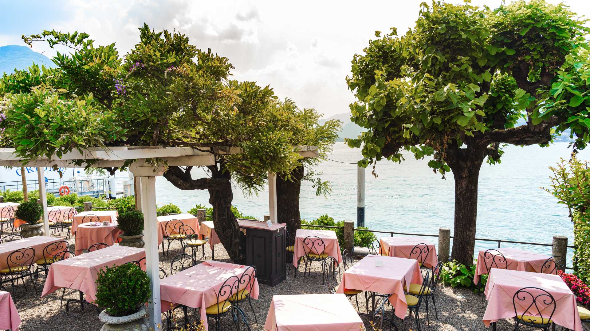 Restaurant with pink tablecloths on Lake Como's shores