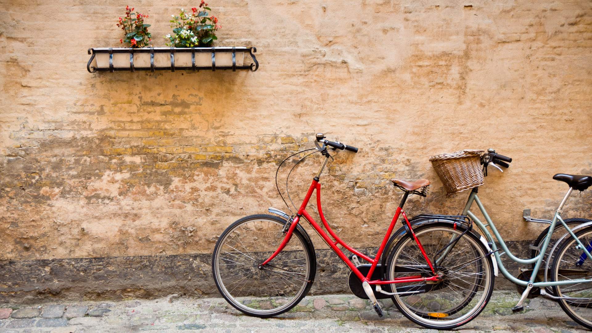 Bicycles by brick wall in Copenhagen