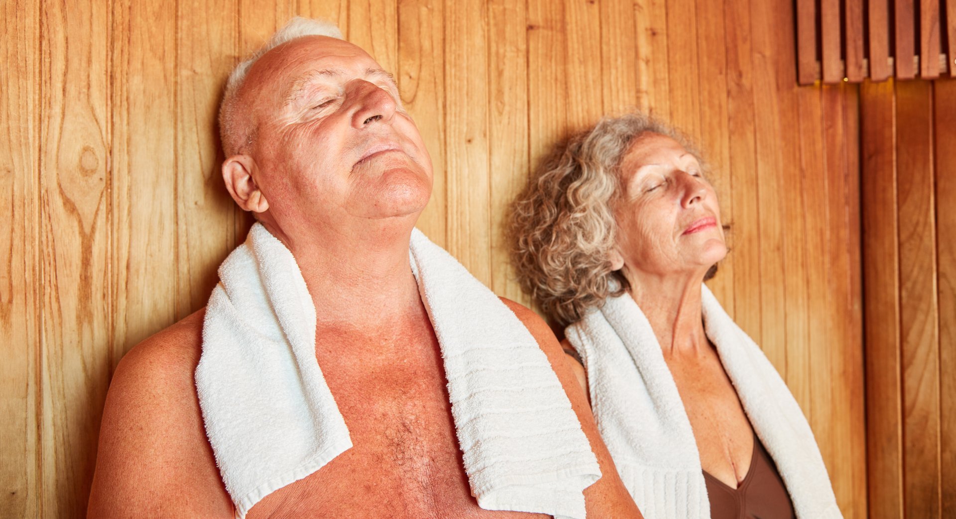Couple relaxing in a Finnish sauna