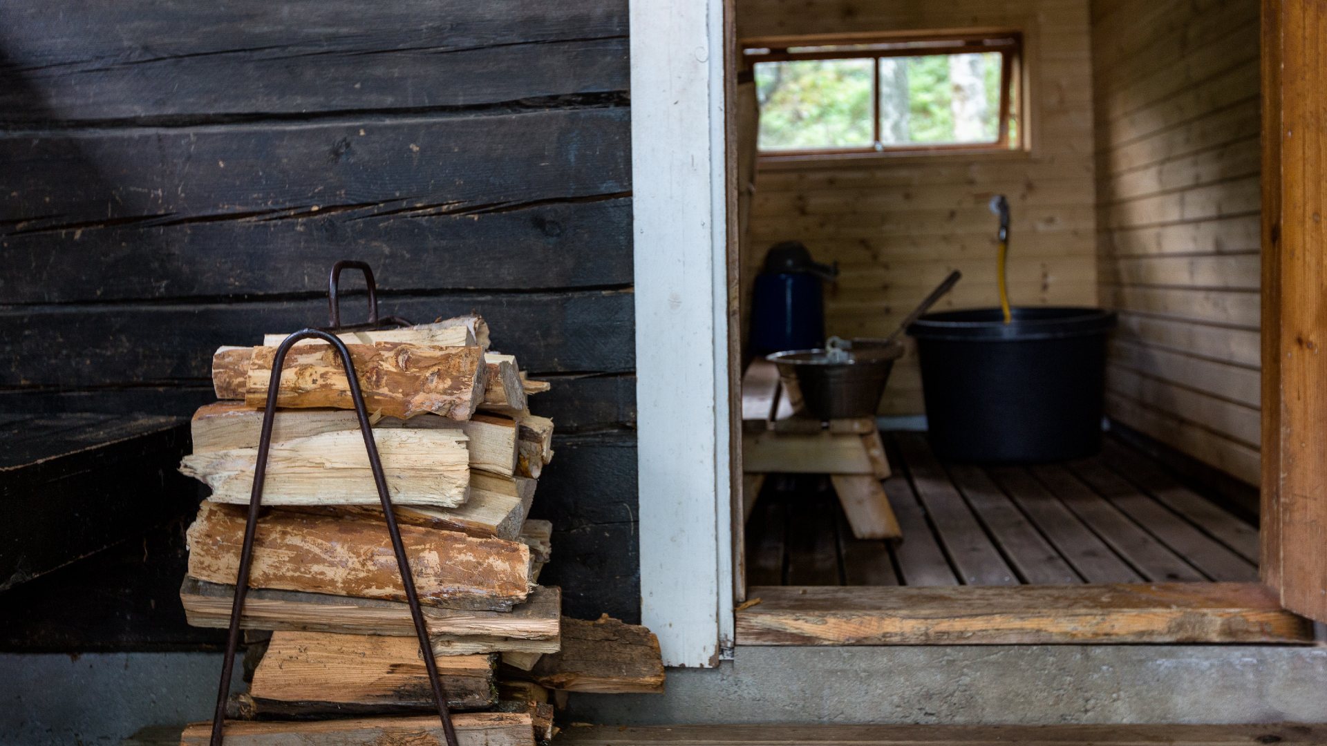 Firewood outside a traditional Finnish sauna
