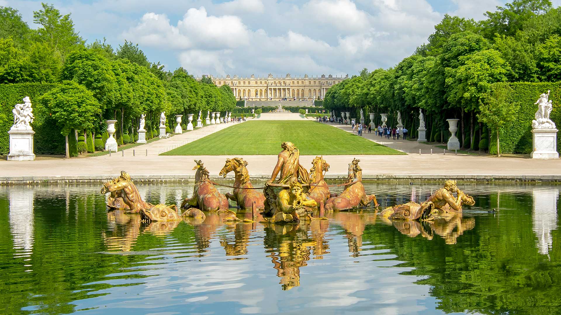 Apollo fountain and Versailles gardens in summertime