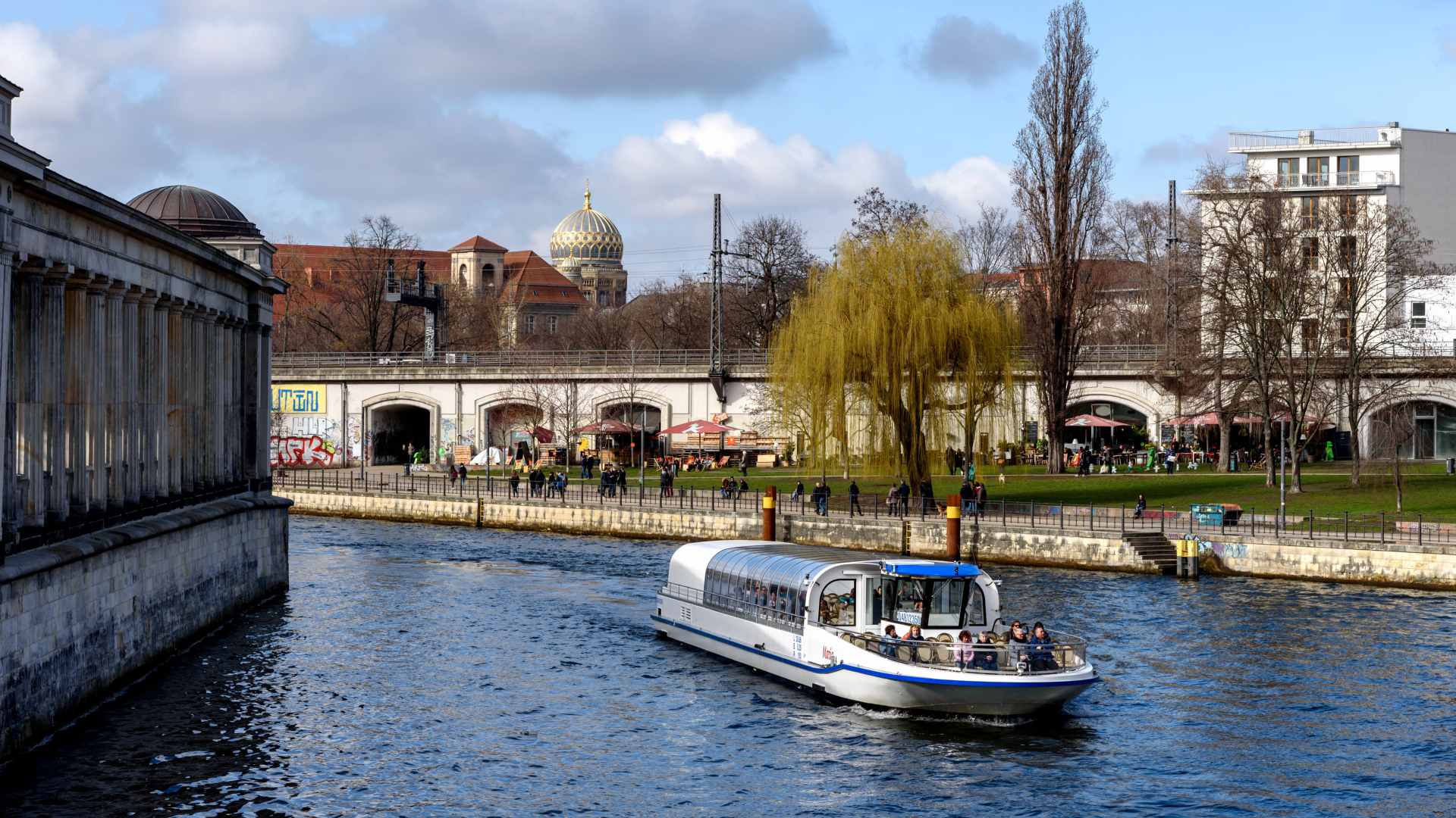 A cruise boat coasting along the river in Berlin