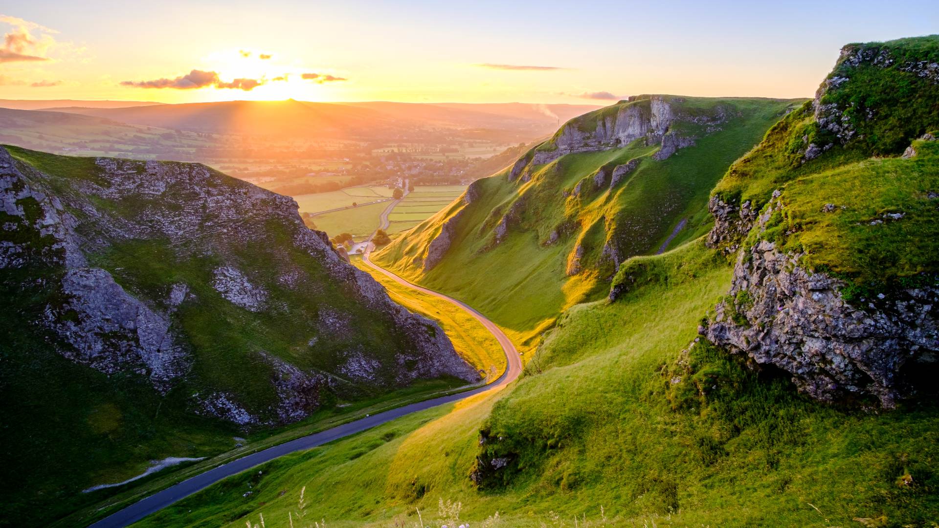 golden sunrise at winnats pass in the peak district england