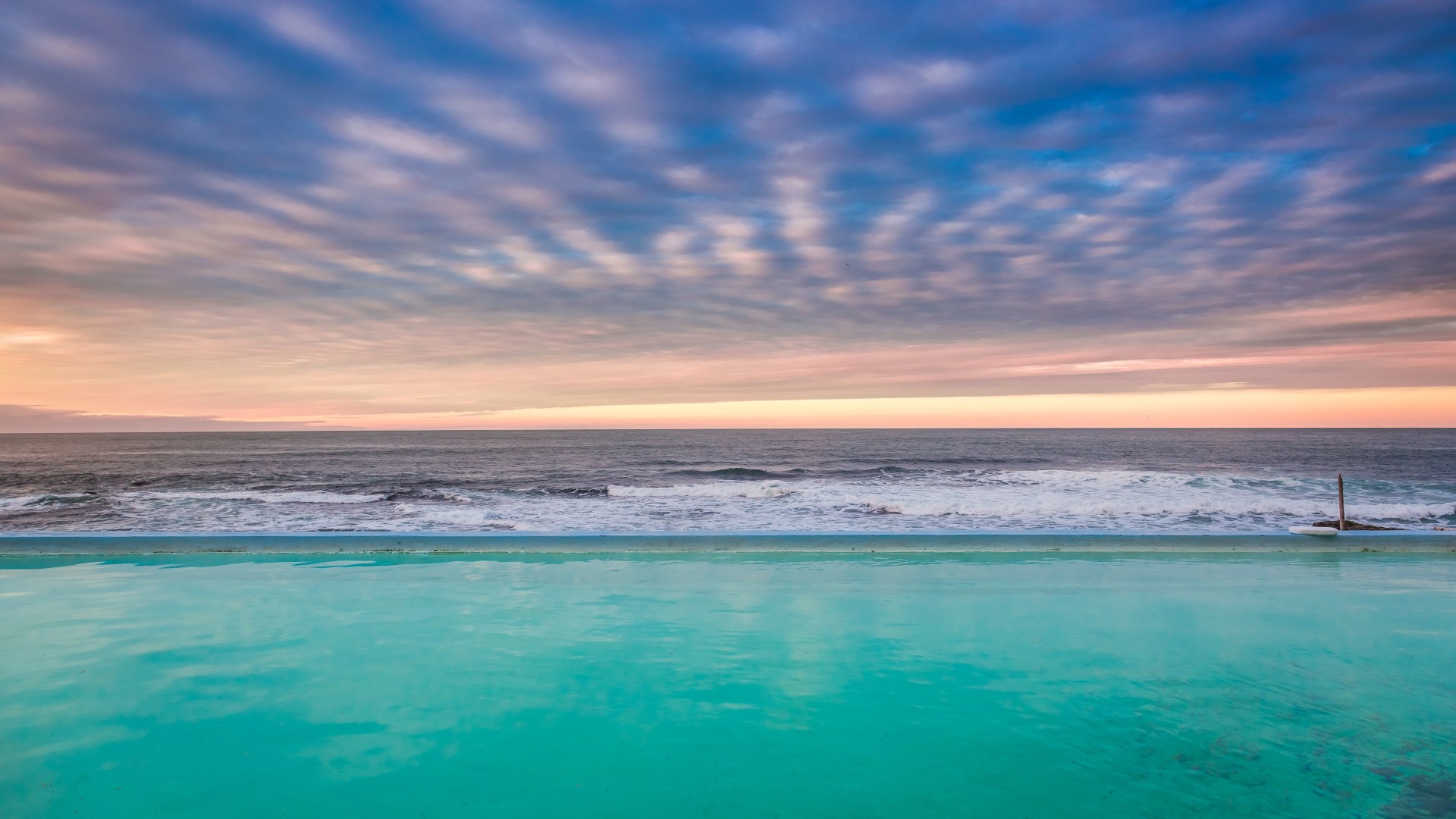 Hot thermal pool in the Westfjords at sunset