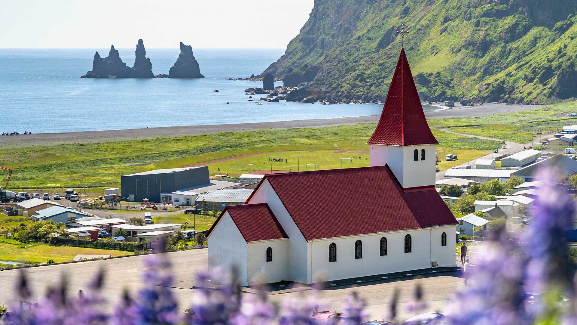 The idyllic red-roofed church in Vik, a small coastal village in Iceland