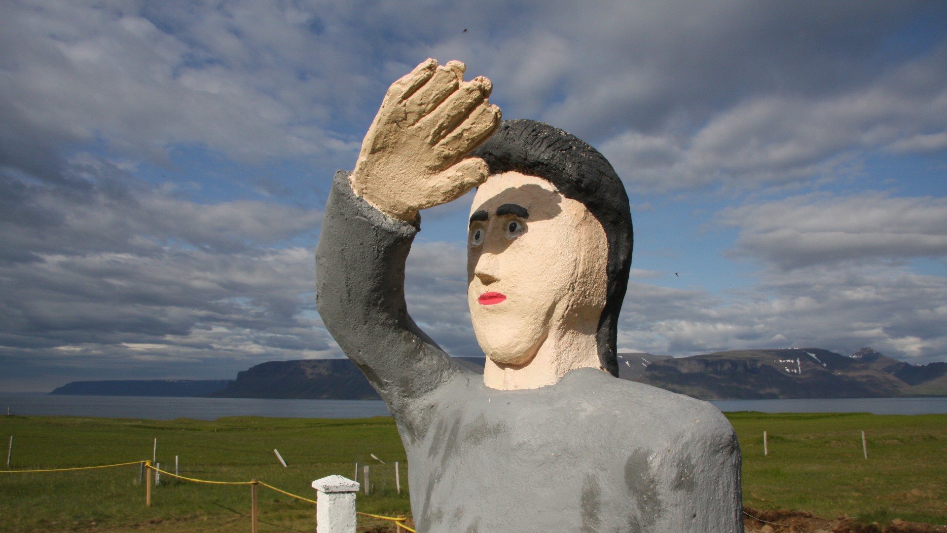 statue at the samuel jonsson museum with view of the fjord