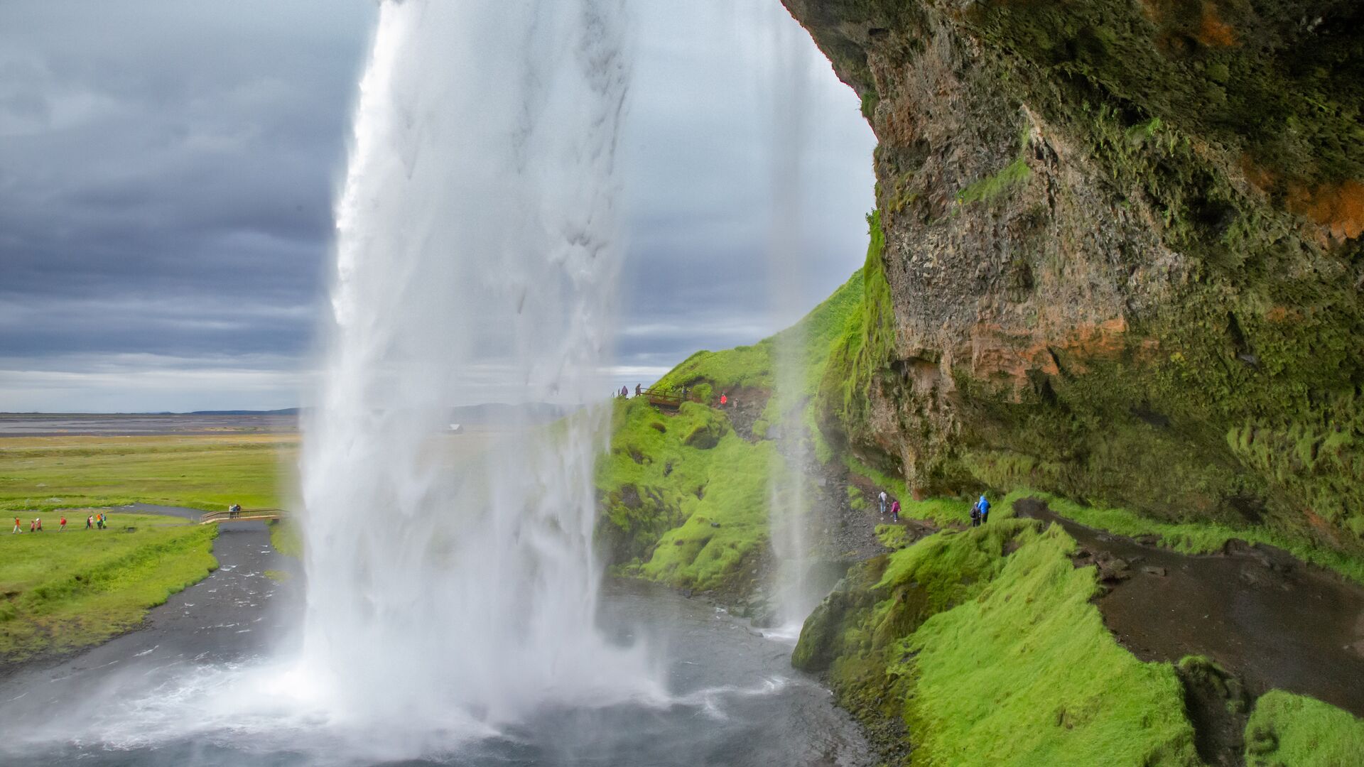 View from behind the veil of water at Seljalandsfoss waterfall