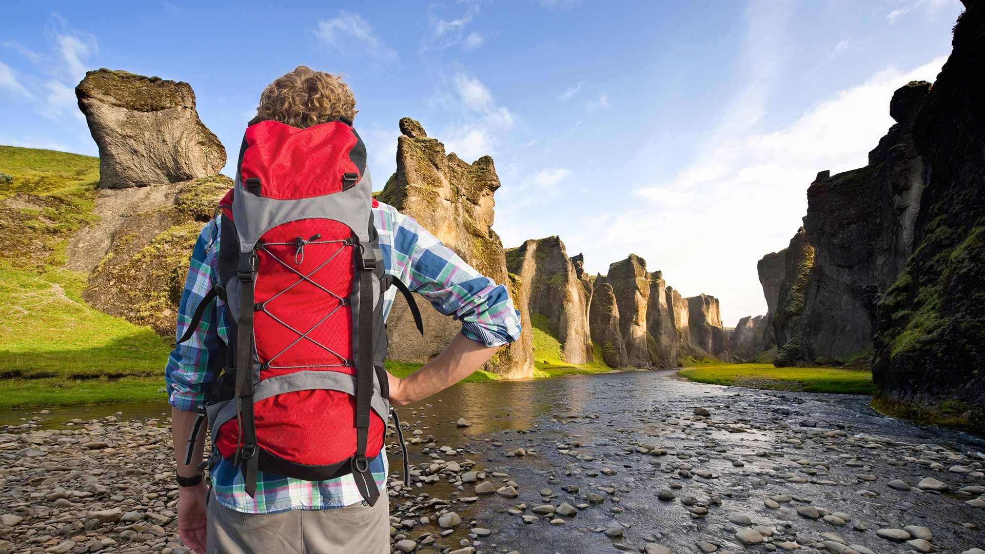 man hiking at fjadrargljufur