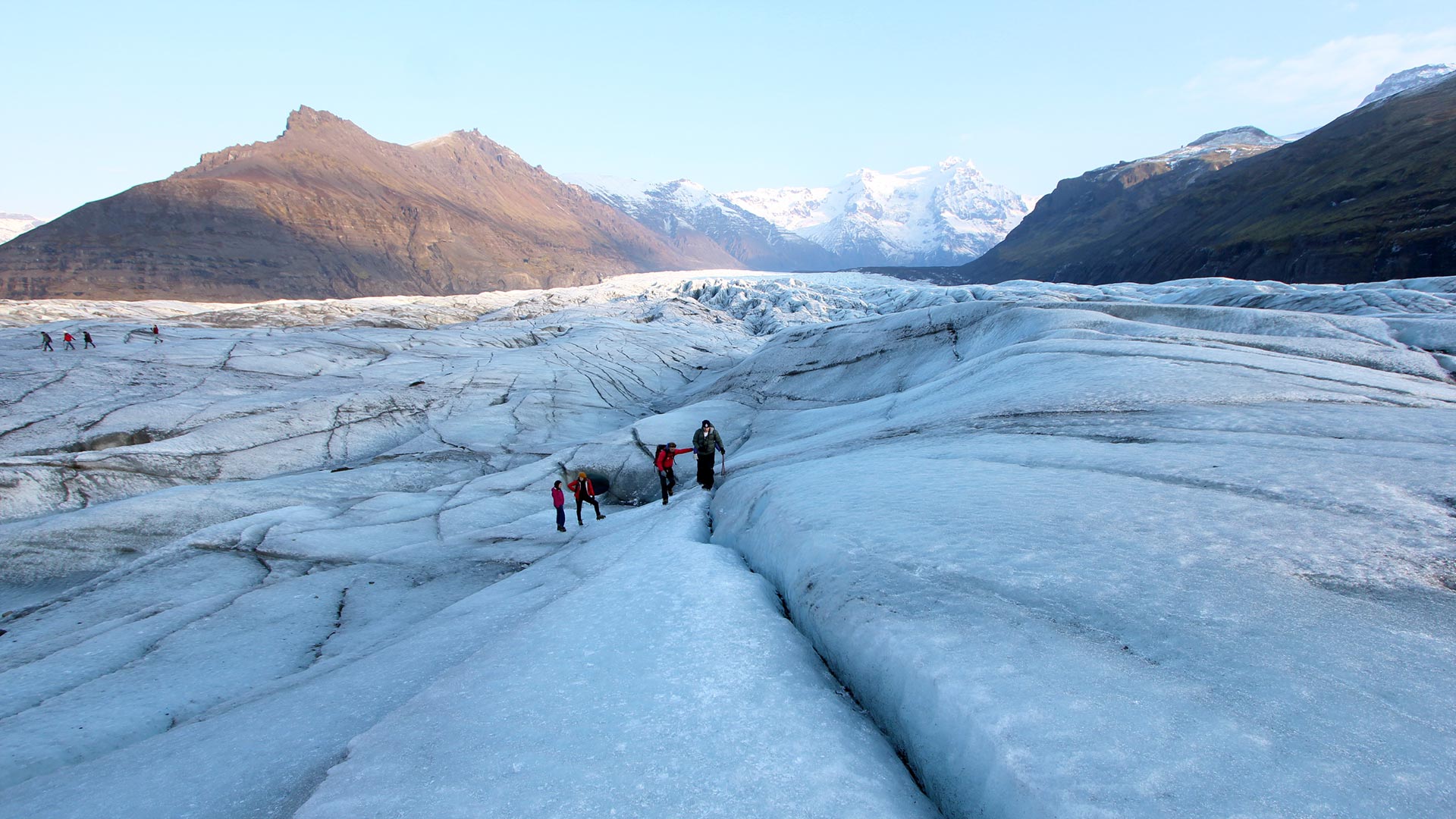 People walking on glacier