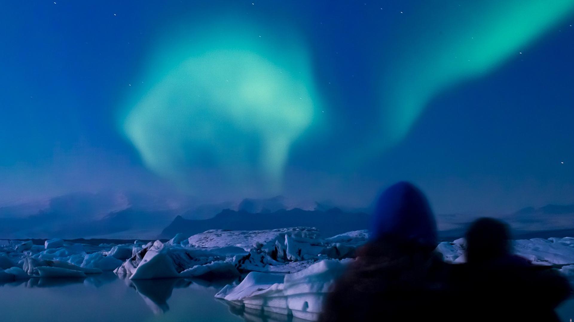 Northern lights over a glacier lagoon, Iceland