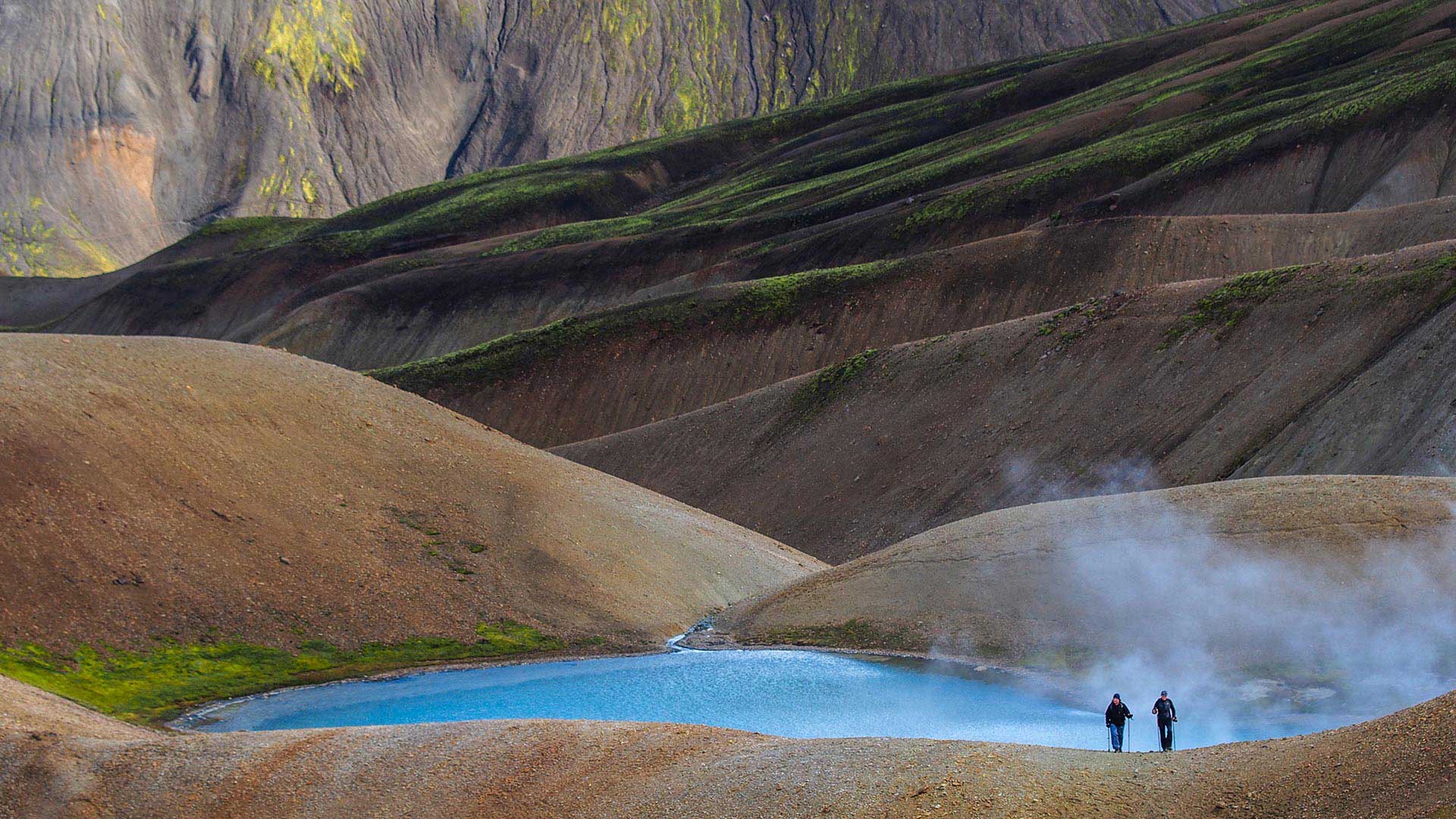 Hikers in the volcanic landscape of Landmannalaugar, Iceland