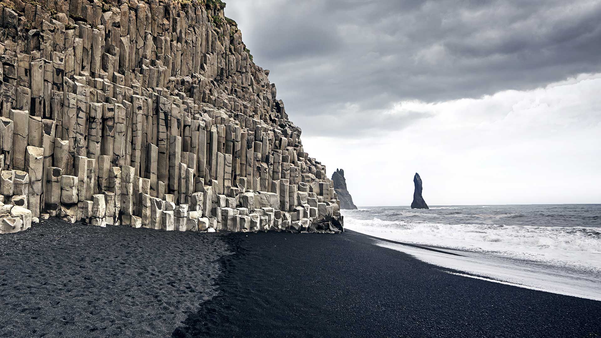 Basalt columns and sea stacks at Reynisfjara beach, Iceland