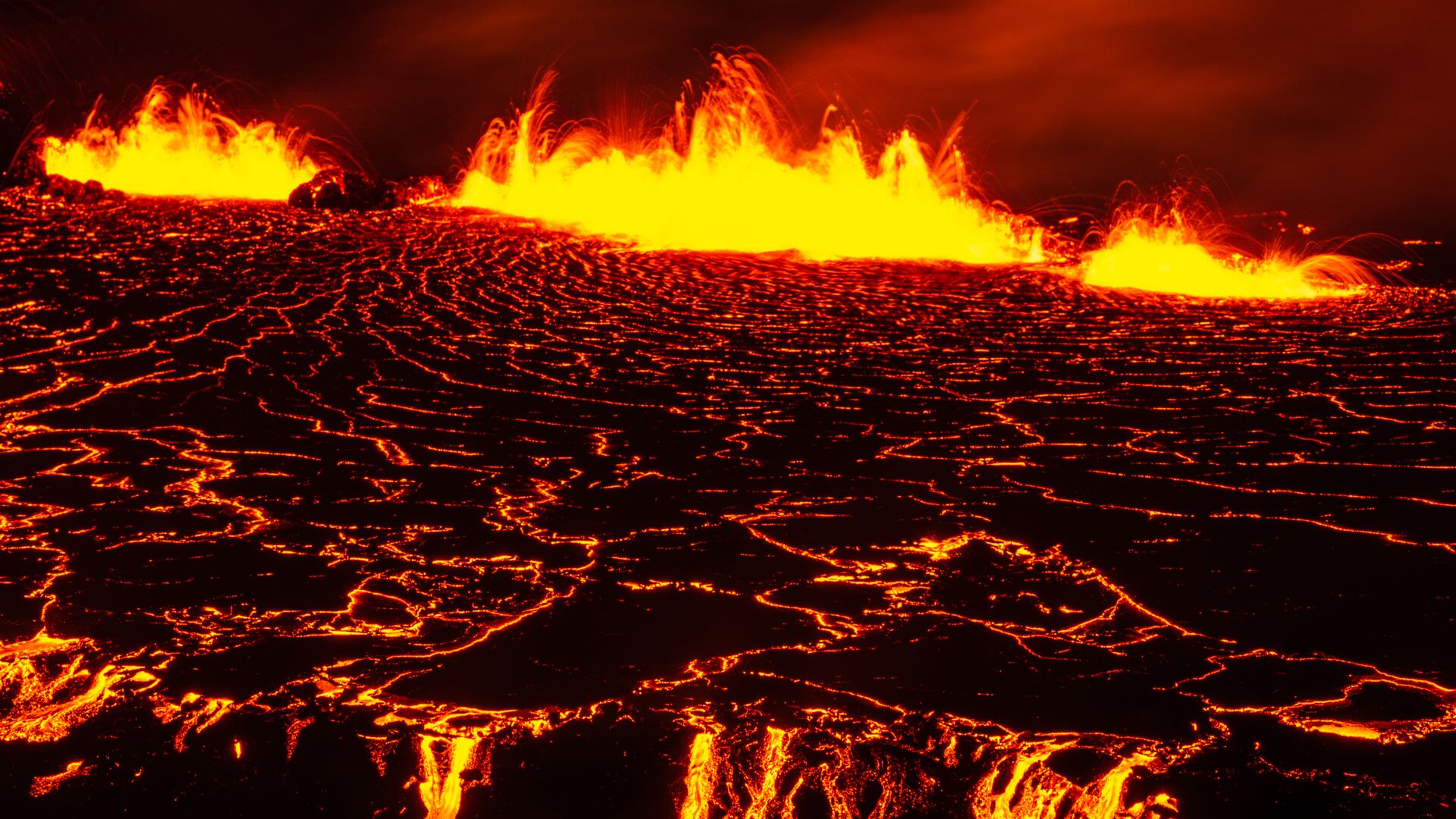 Orange lava at the volcano eruption site in Meradalir, Fagradalsfjall