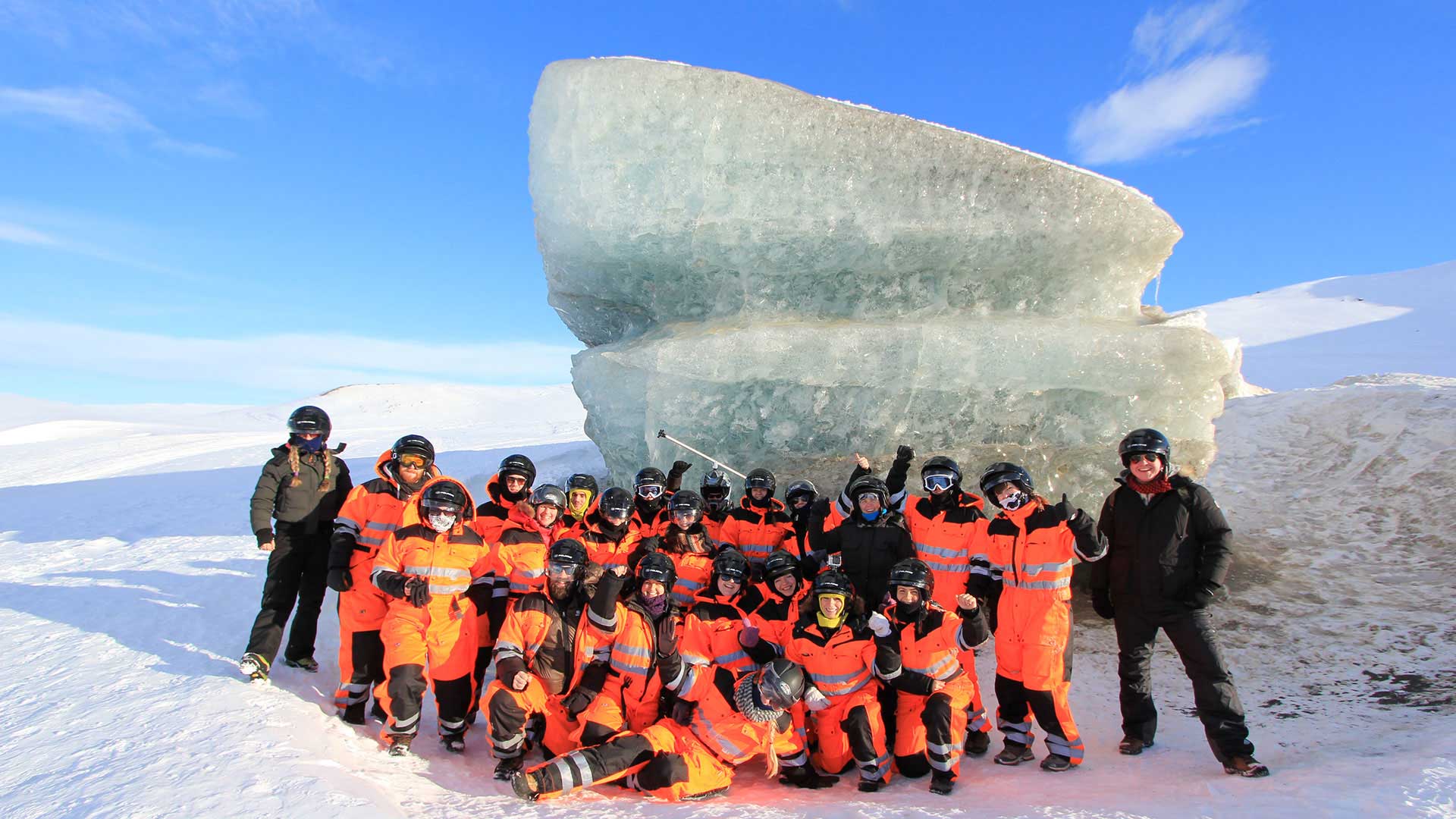 group taking a photo after snowmobile trip