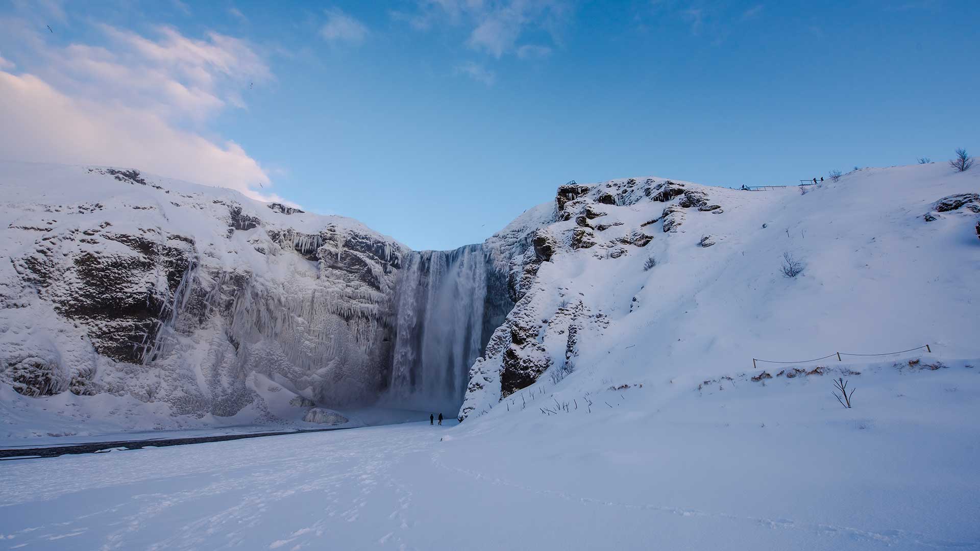 skogafoss waterfall under snow