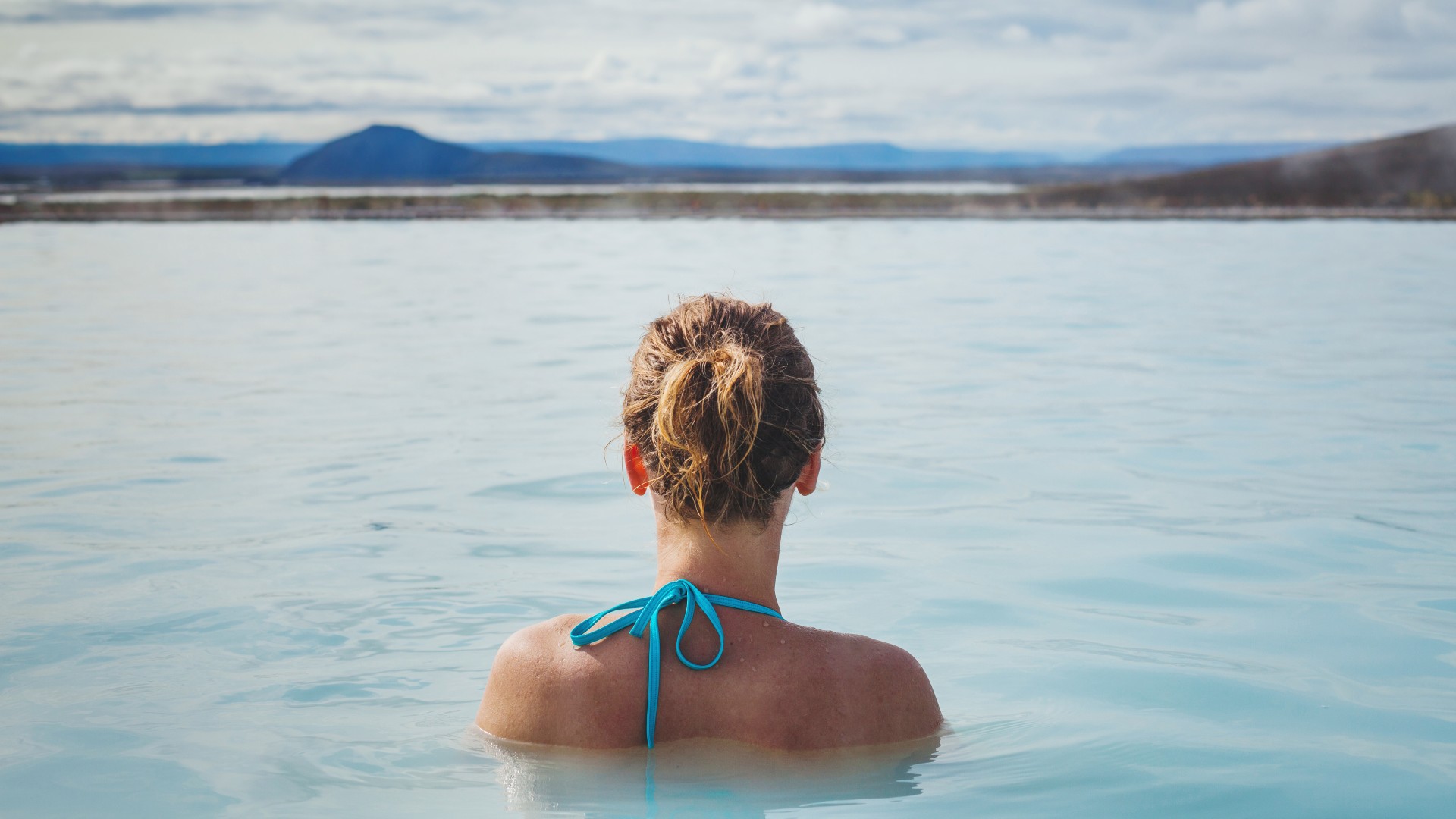 Woman bathing in the Myvatn Nature Baths