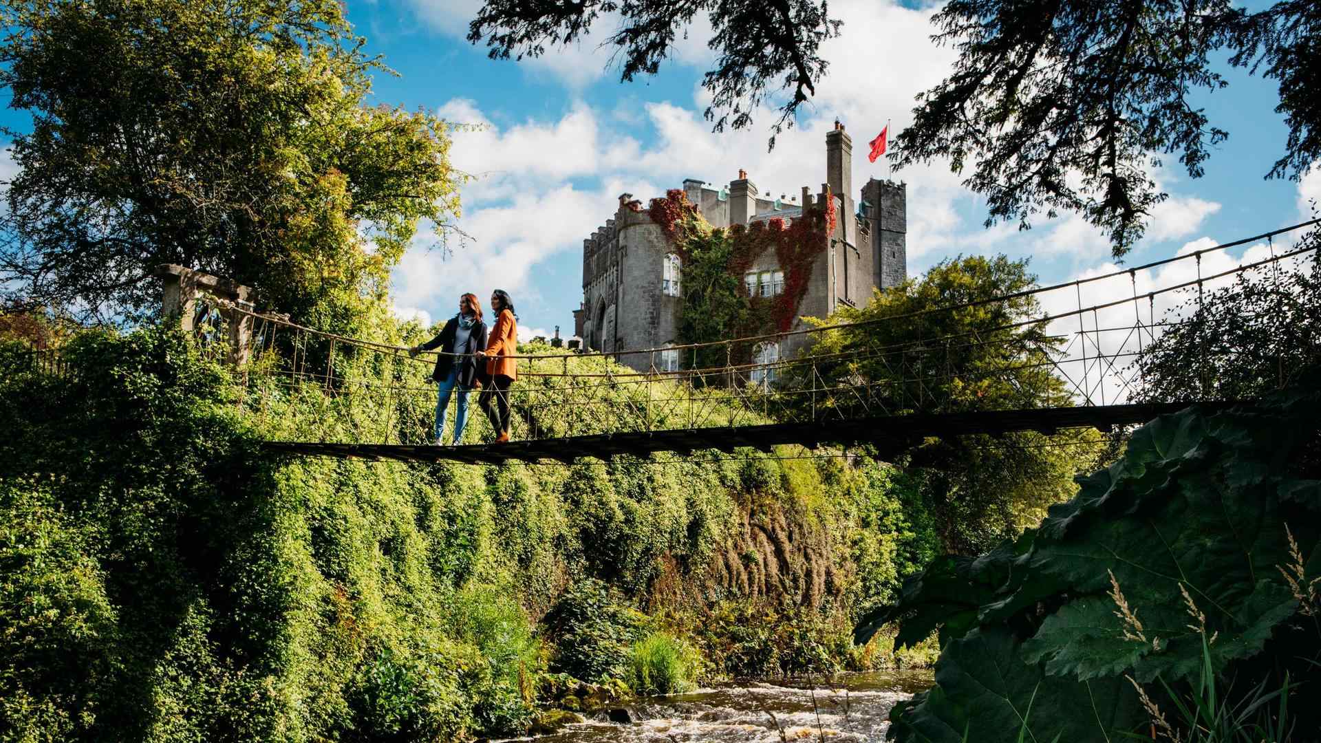 People on the drawbridge at Birr Castle, County Offaly, Ireland