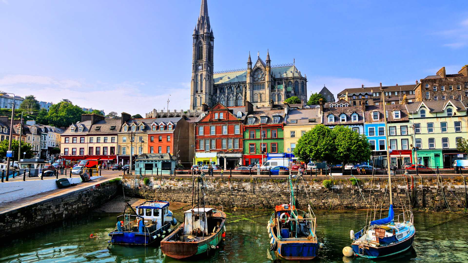 Colourful buildings and old boats in the harbour of Cobh, County Cork
