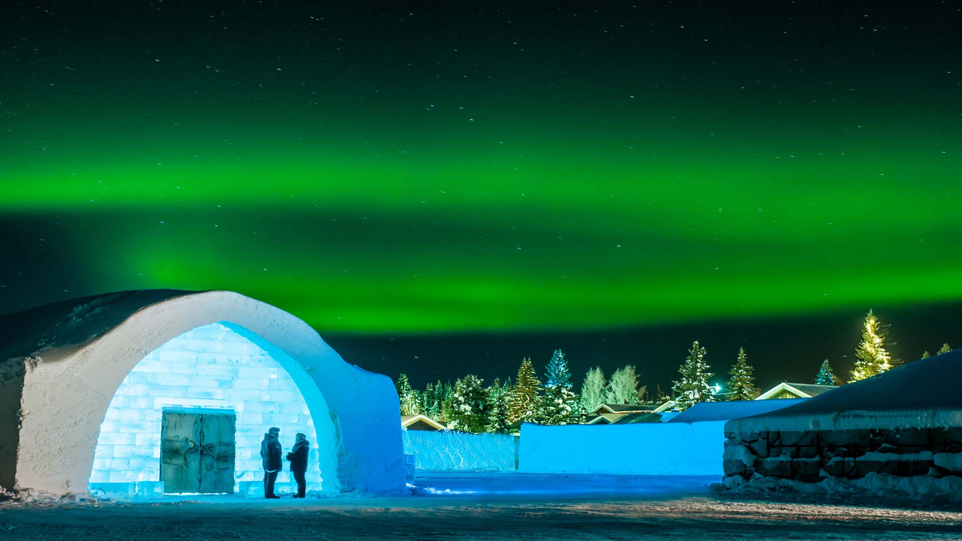 The Northern lights dancing above the ICEHOTEL in Sweden