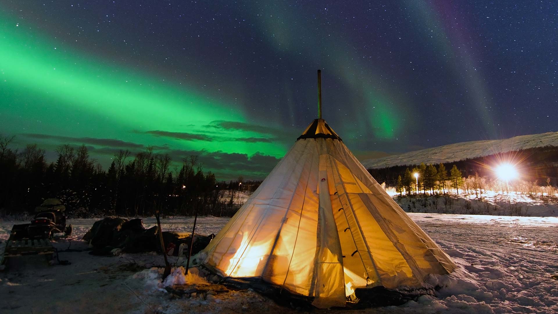 northern lights over sami tents