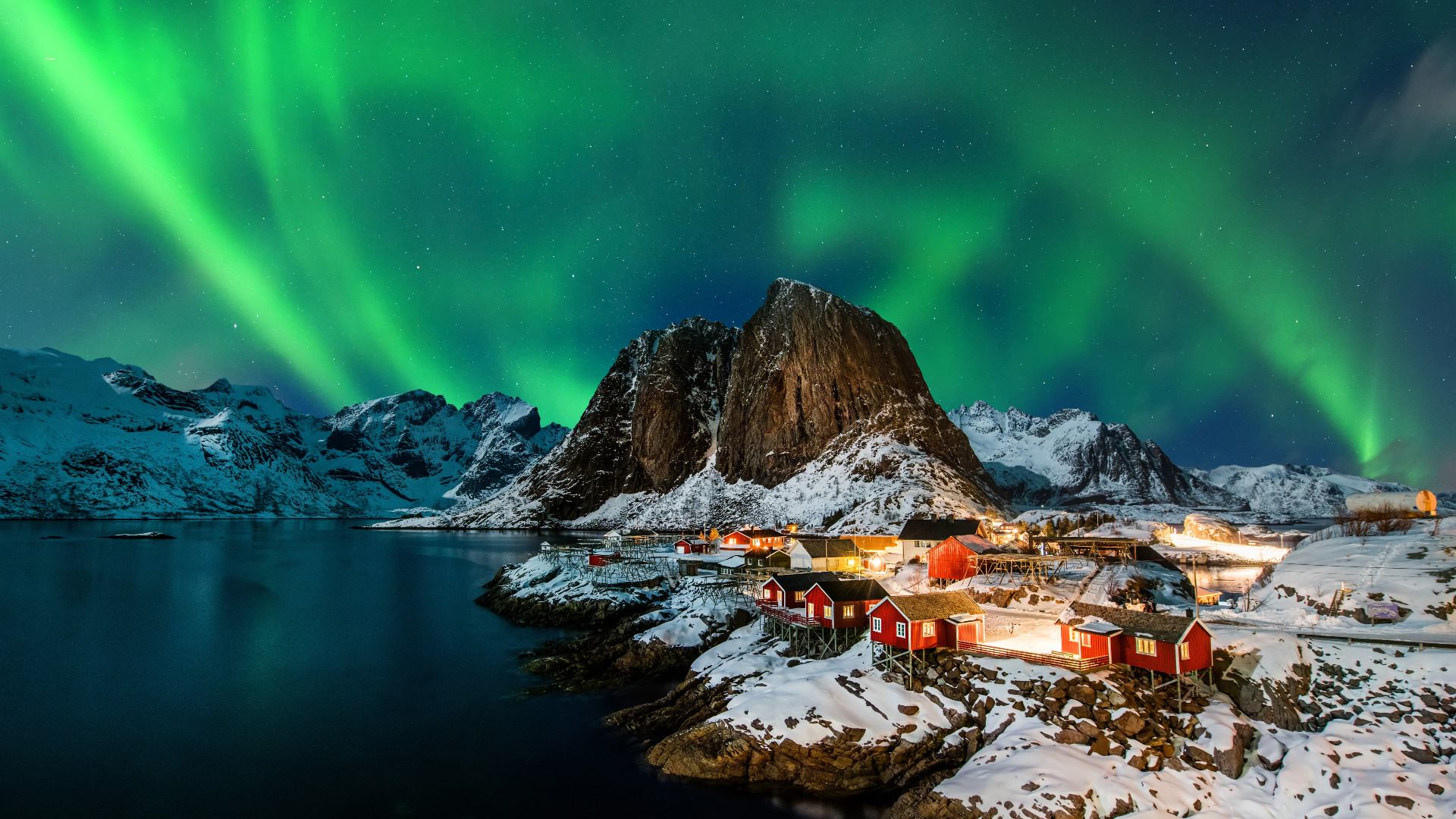 The northern lights over Hamnøy village in the Lofoten Islands, Norway.