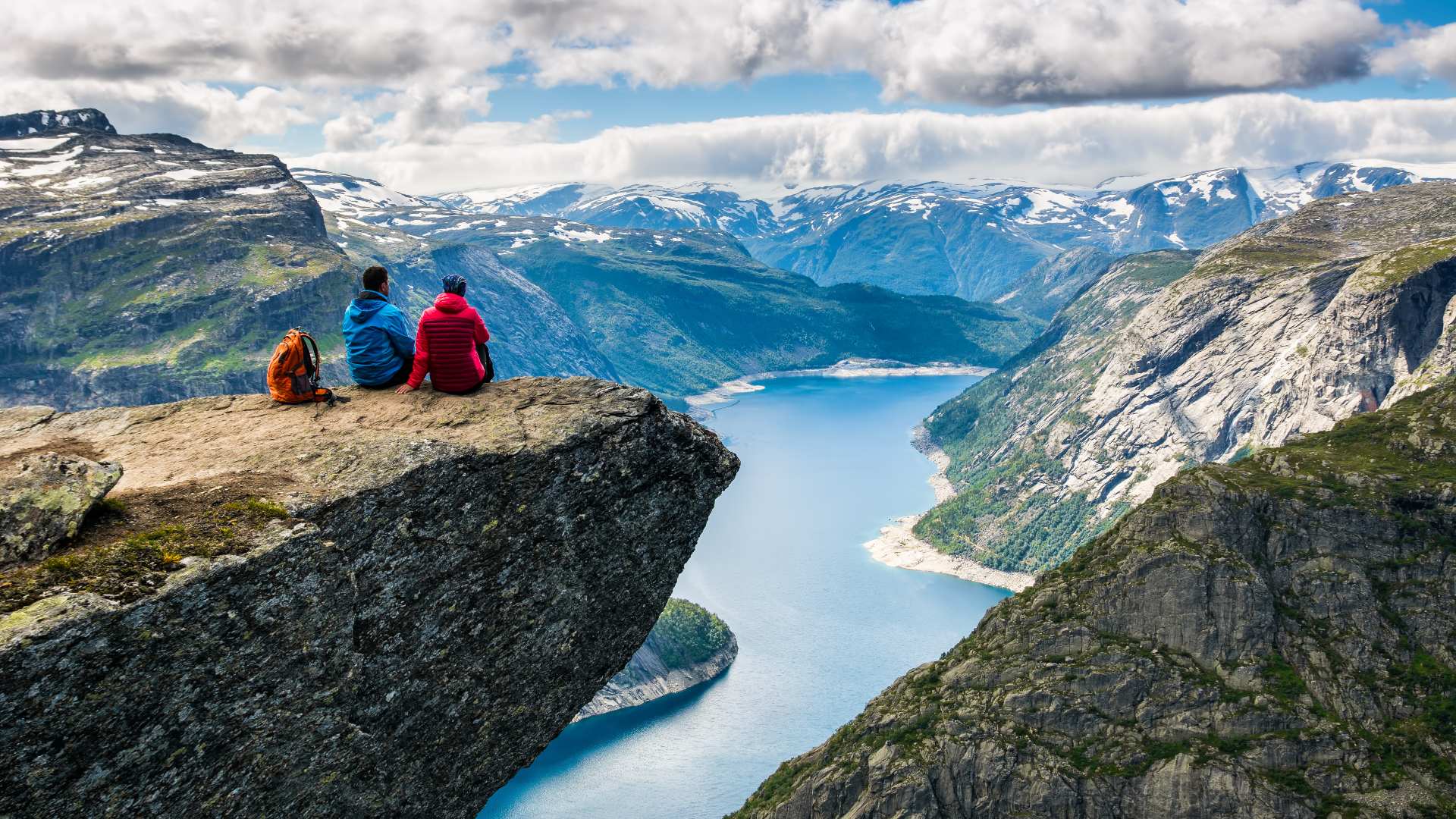 couple admiring the view trolltunga norway