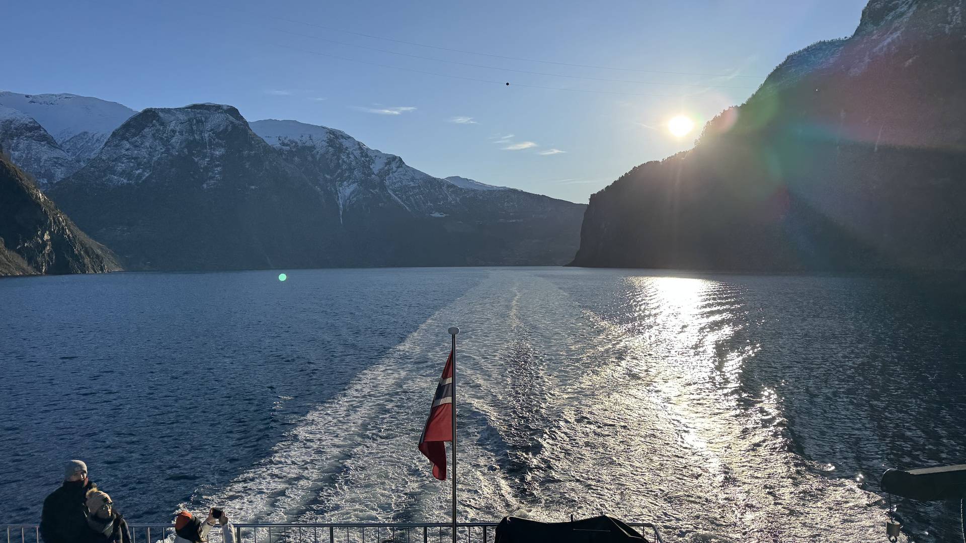The view from the back of a boat on a Norway fjord