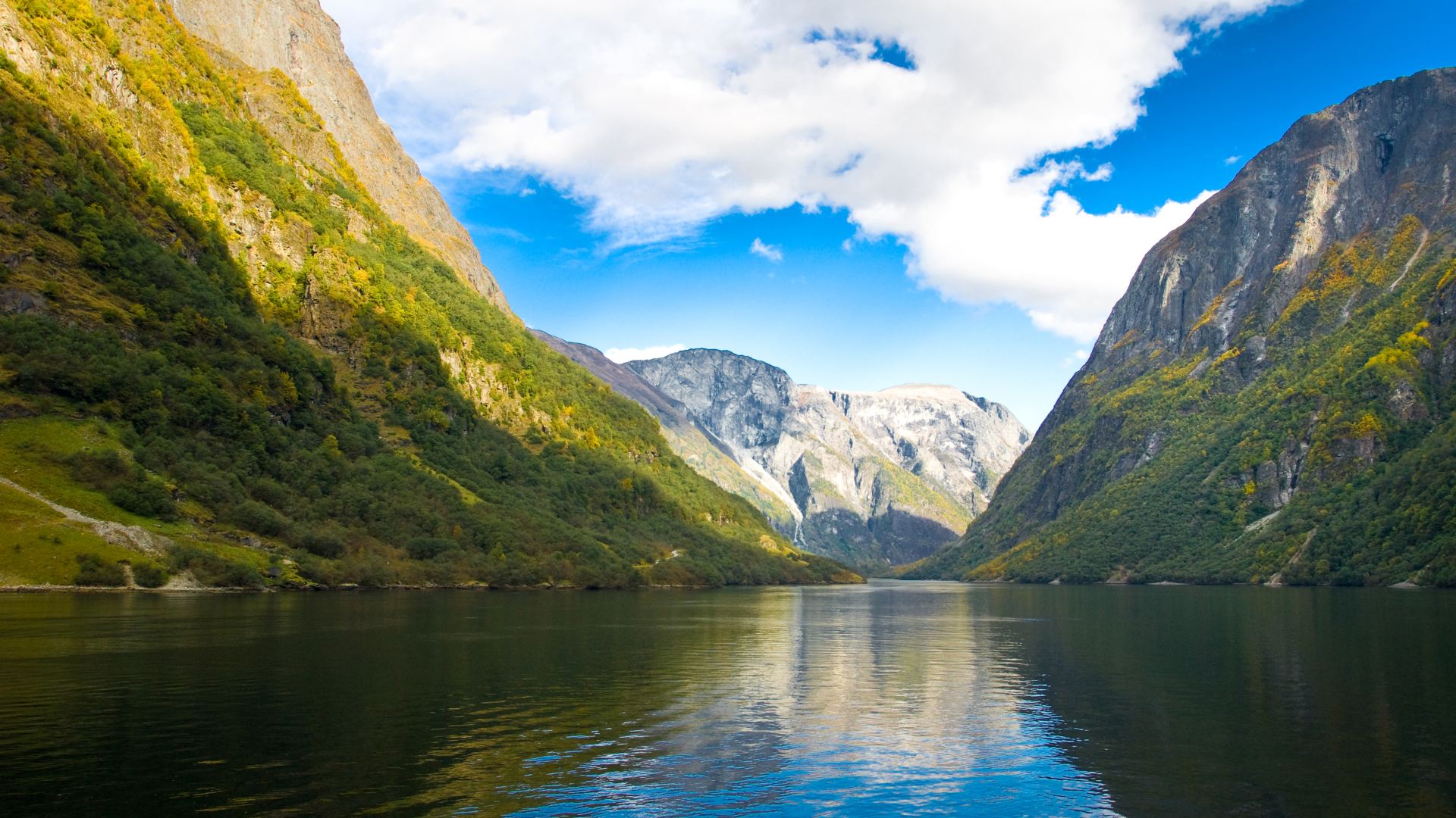 Mountains in Norway and fjords reflecting the blue sky