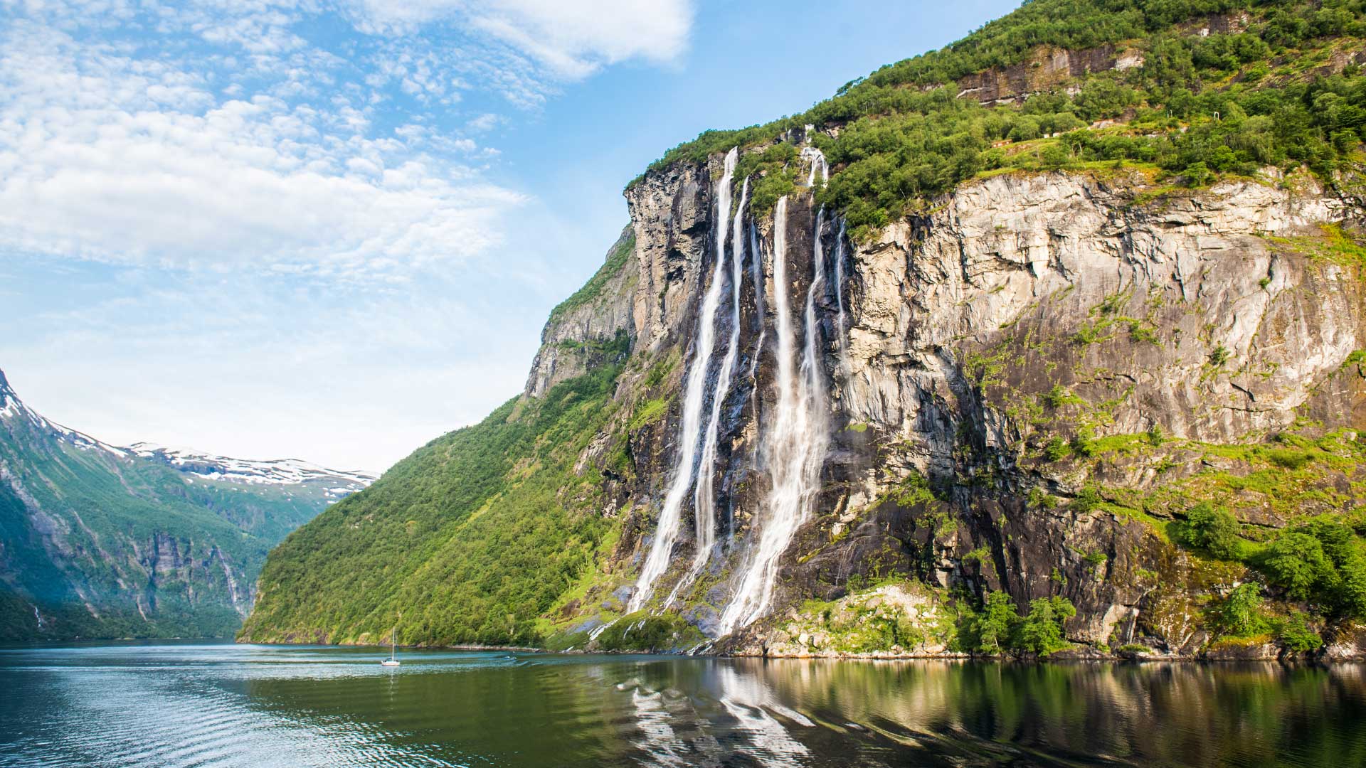 The graceful Seven Seven waterfall rolling into the fjord.